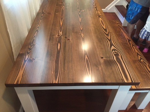 dark walnut farmhouse table and accent bench