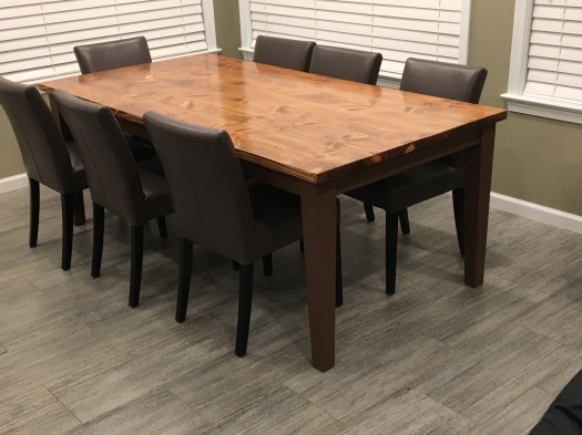 farmhouse table with tapered brown legs